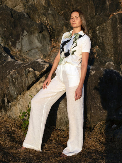 High waisted white linen pants styled for a chic summer outfit